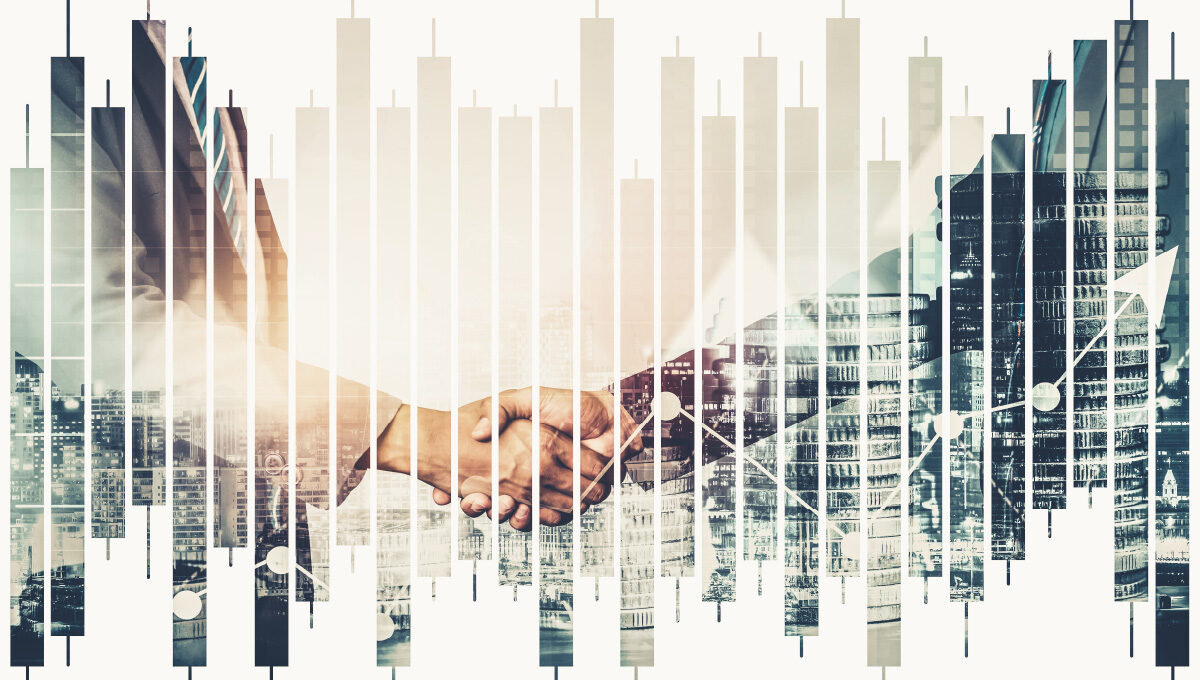 A financial chart is overlaying two business people shaking hands.