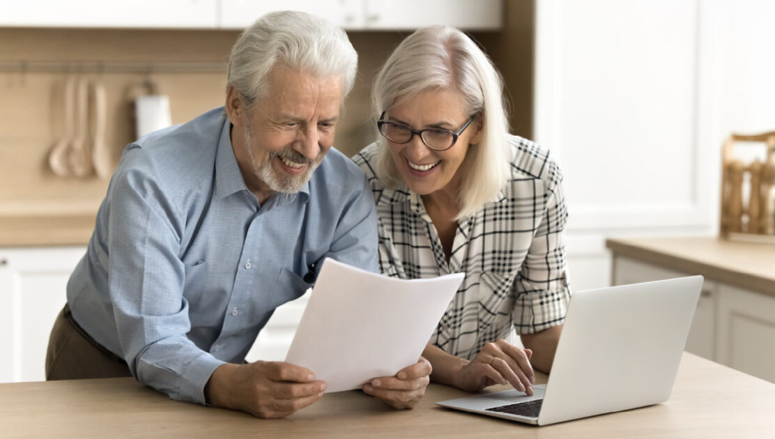 A senior couple excited to learn about social security spousal benefits.