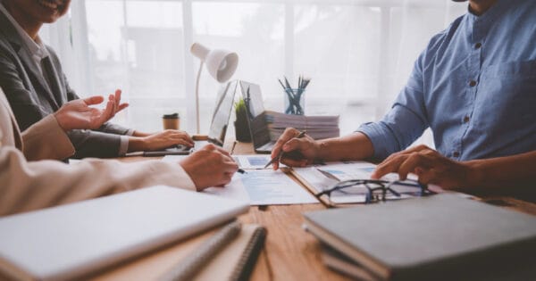 A financial advisor helping a couple re-evaluate their cash holdings.