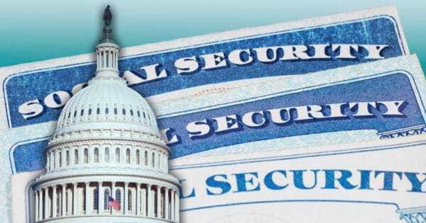 The Capitol Dome over a background of Social Security cards.